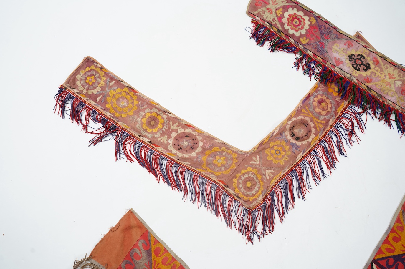 Five various sized late 19th / early 20th century Usbek Saye Gosha (V shaped) Suzani silk embroidered bridal yurt wall hangings, usually forming part of a dowry, two with later fringing, longest 172cm. Condition - some f